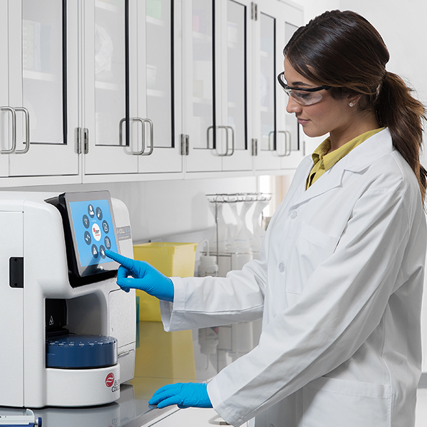 user using Vi-CELL BLU Cell Viability Analyzer in the lab