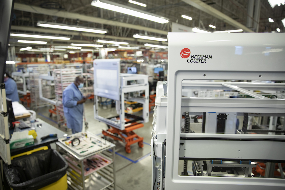 Employees assembling instruments in Beckman factory