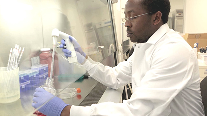 CARES Solution man pipetting in hood