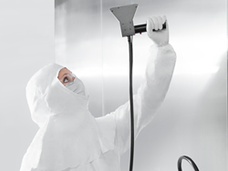 cleanroom technician using filter probe for environmental monitoring air particle counts