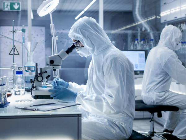 Scientists wearing protective gear