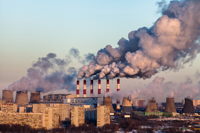 Thick smoke from thermal power plants over the residential areas of the city